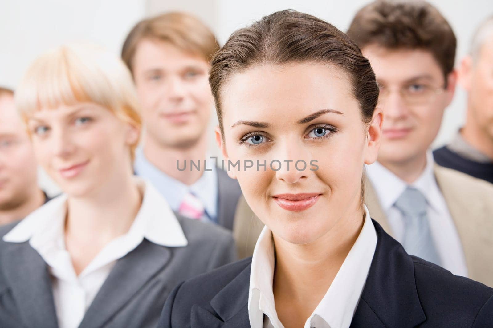 Photo of female leader with her business team