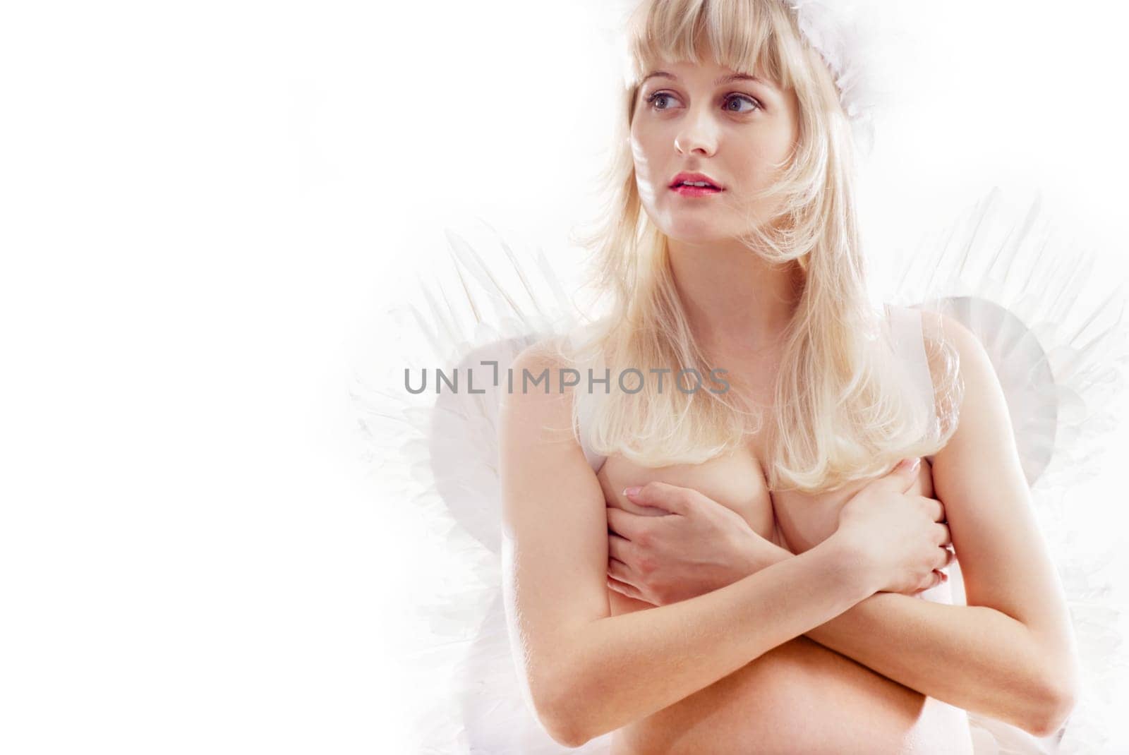Close up of pregnant woman wearing wings