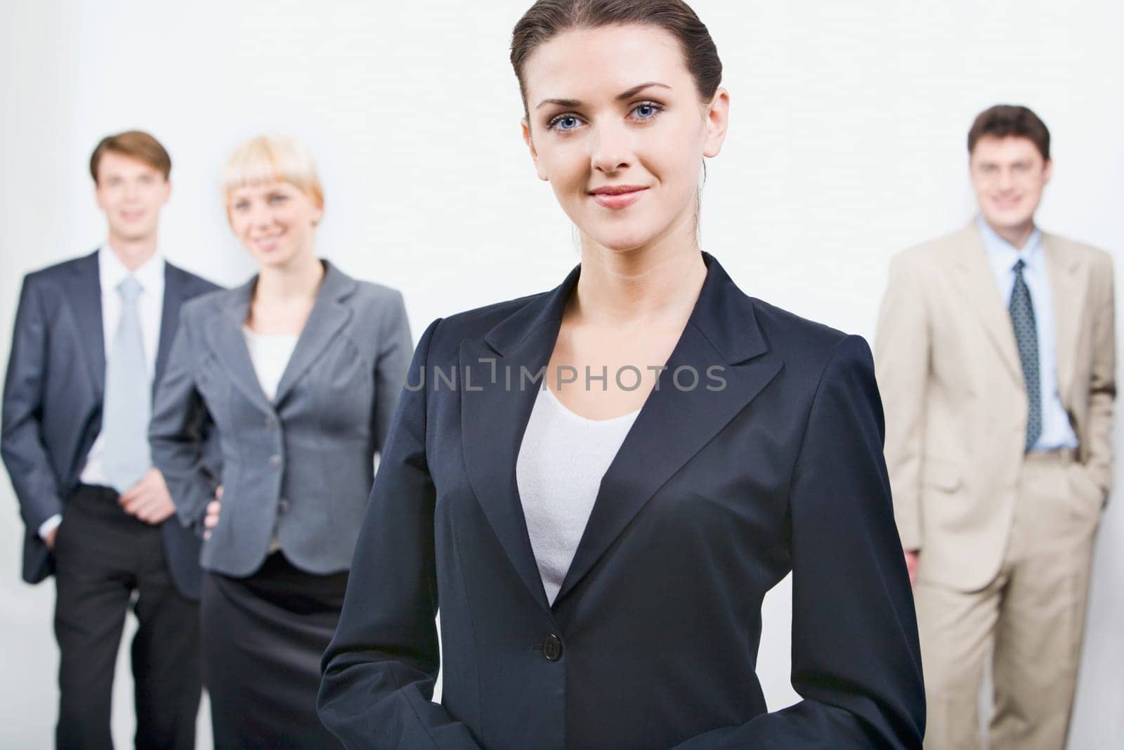 Business  team with its leader is against white background