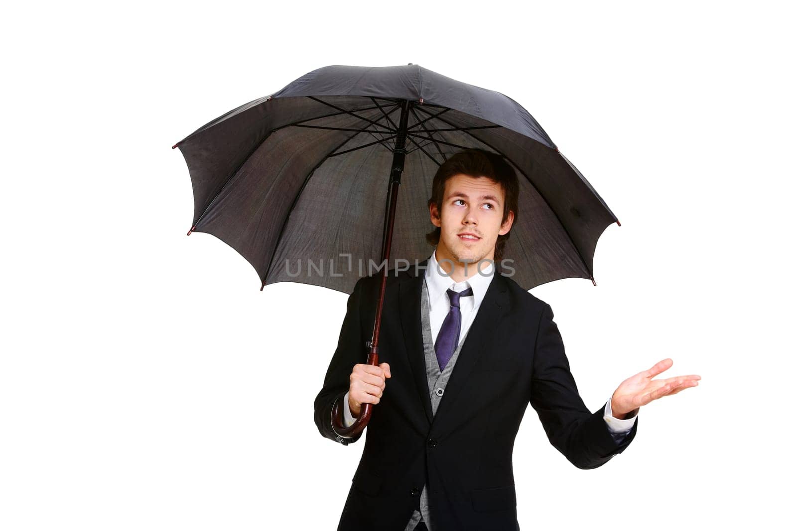Image of elegant businessman under black umbrella