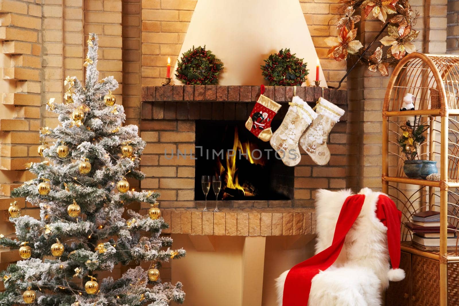 Christmas room with fireplace, chair, presents under decorated fir tree and toys in it