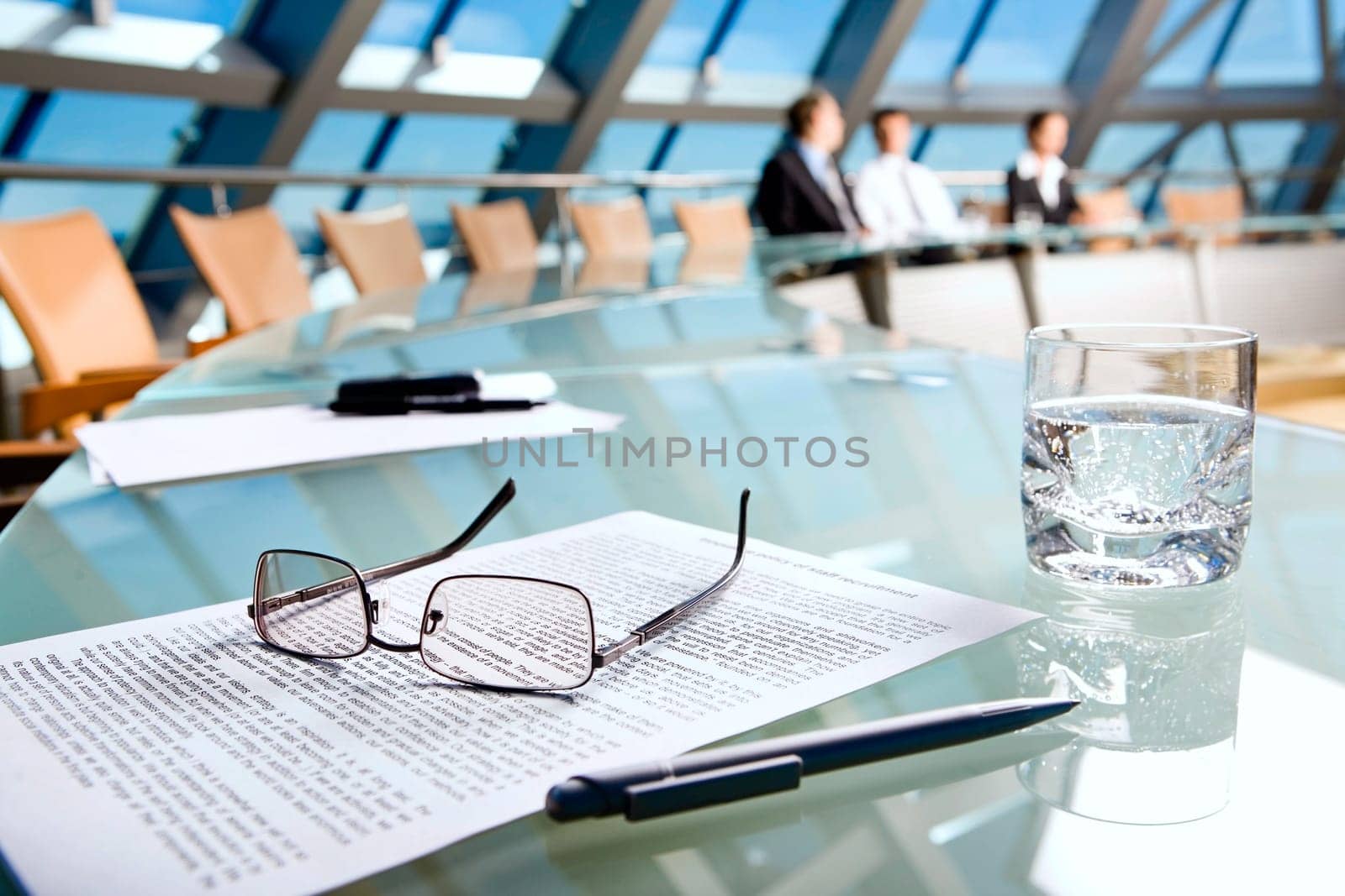 Image of several objects lying on the table in the conference room