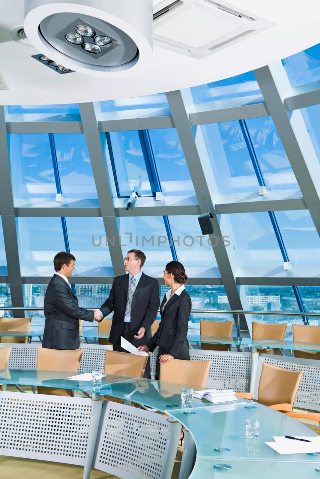 Businessmen shaking hands in the conference room