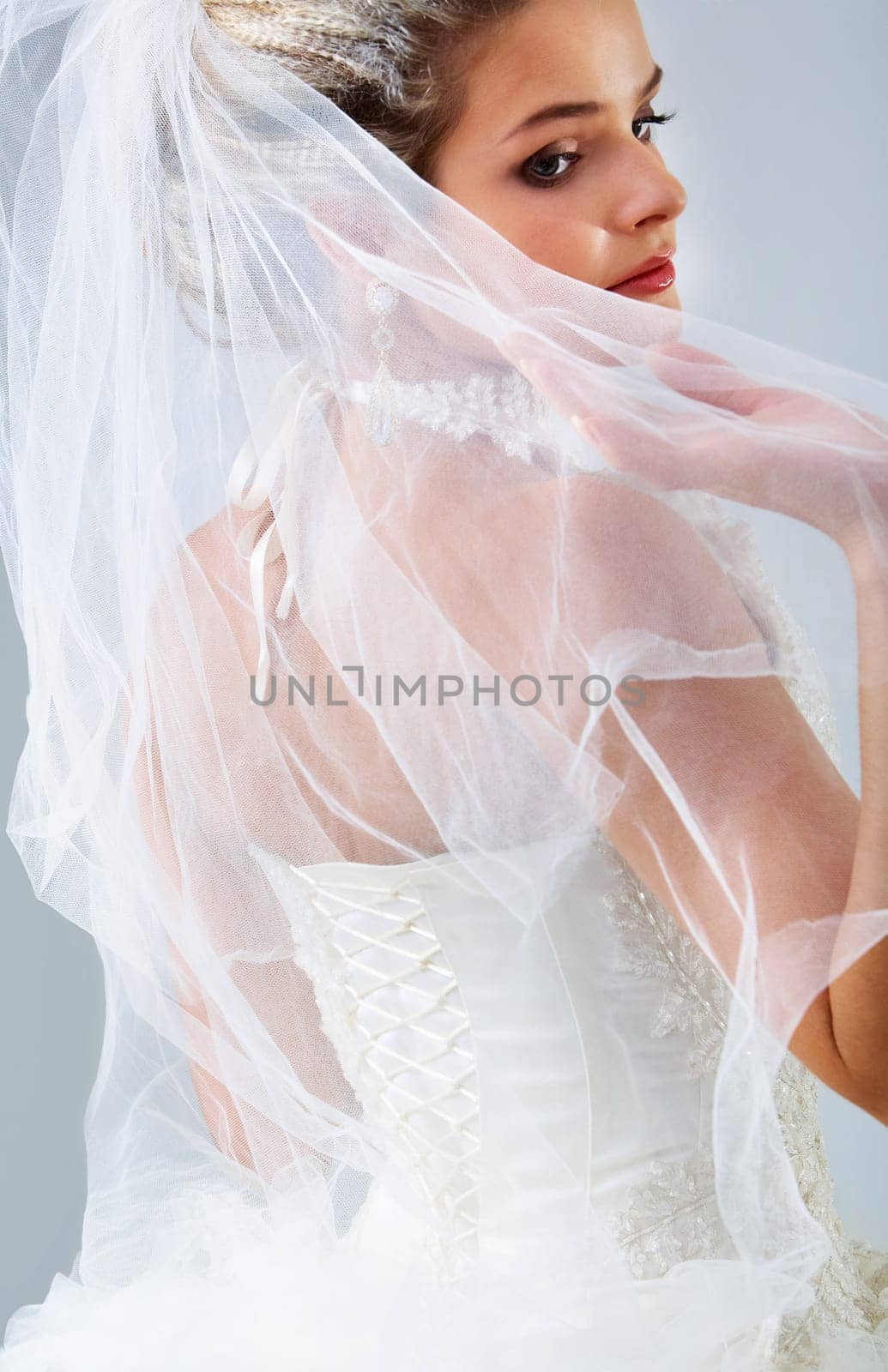 Portrait of pretty bride posing in isolation