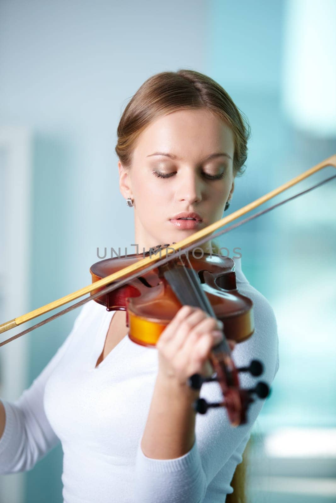 Portrait of a young female playing the violin