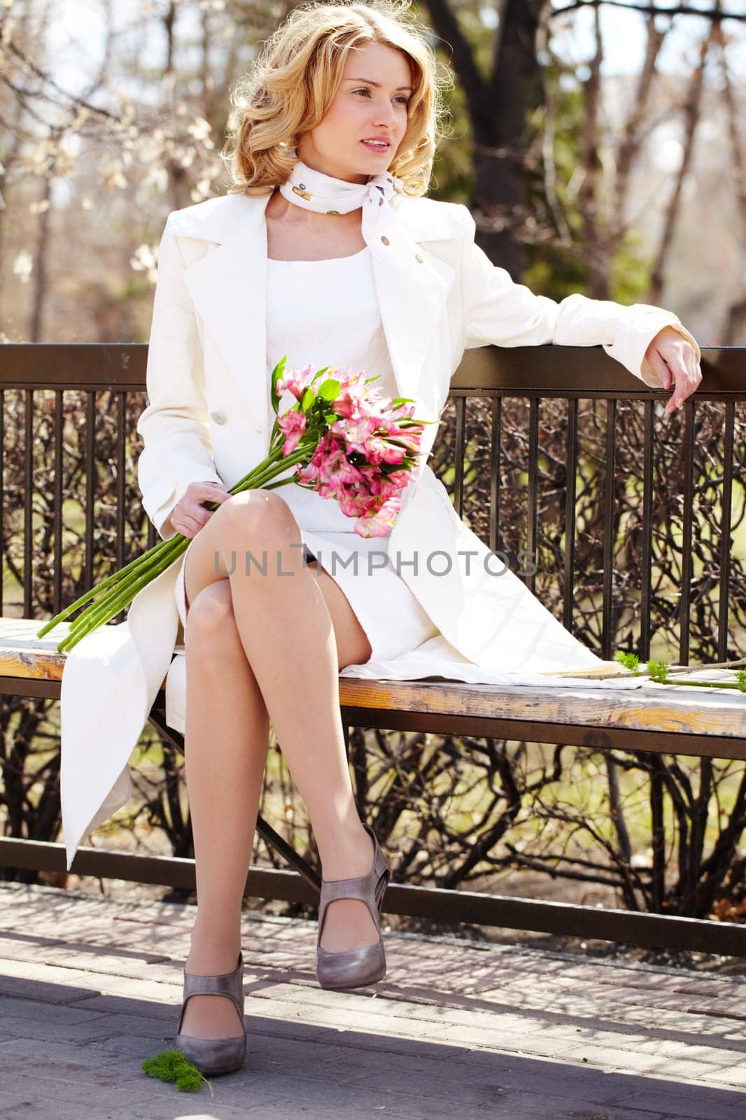 Portrait of a young girl waiting somebody on bench