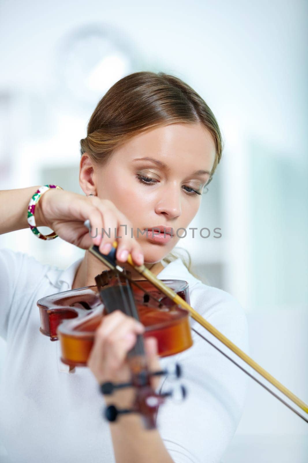 Portrait of a young female playing the violin