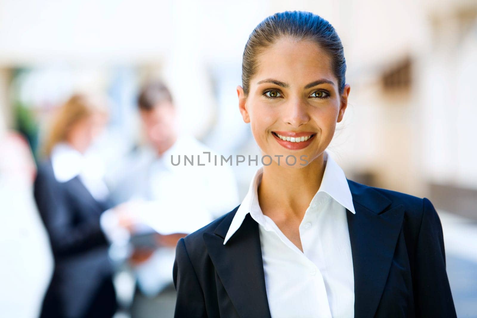 Successful young business woman with charming confident smile