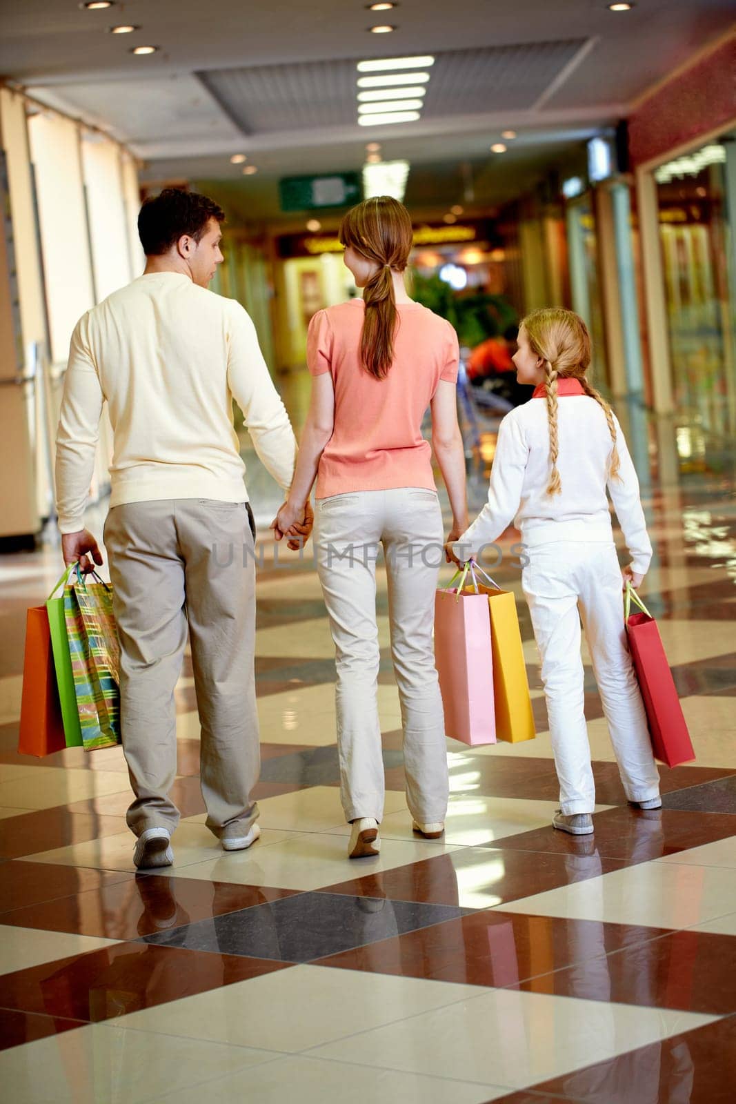 Image of family going to leave the mall after shopping