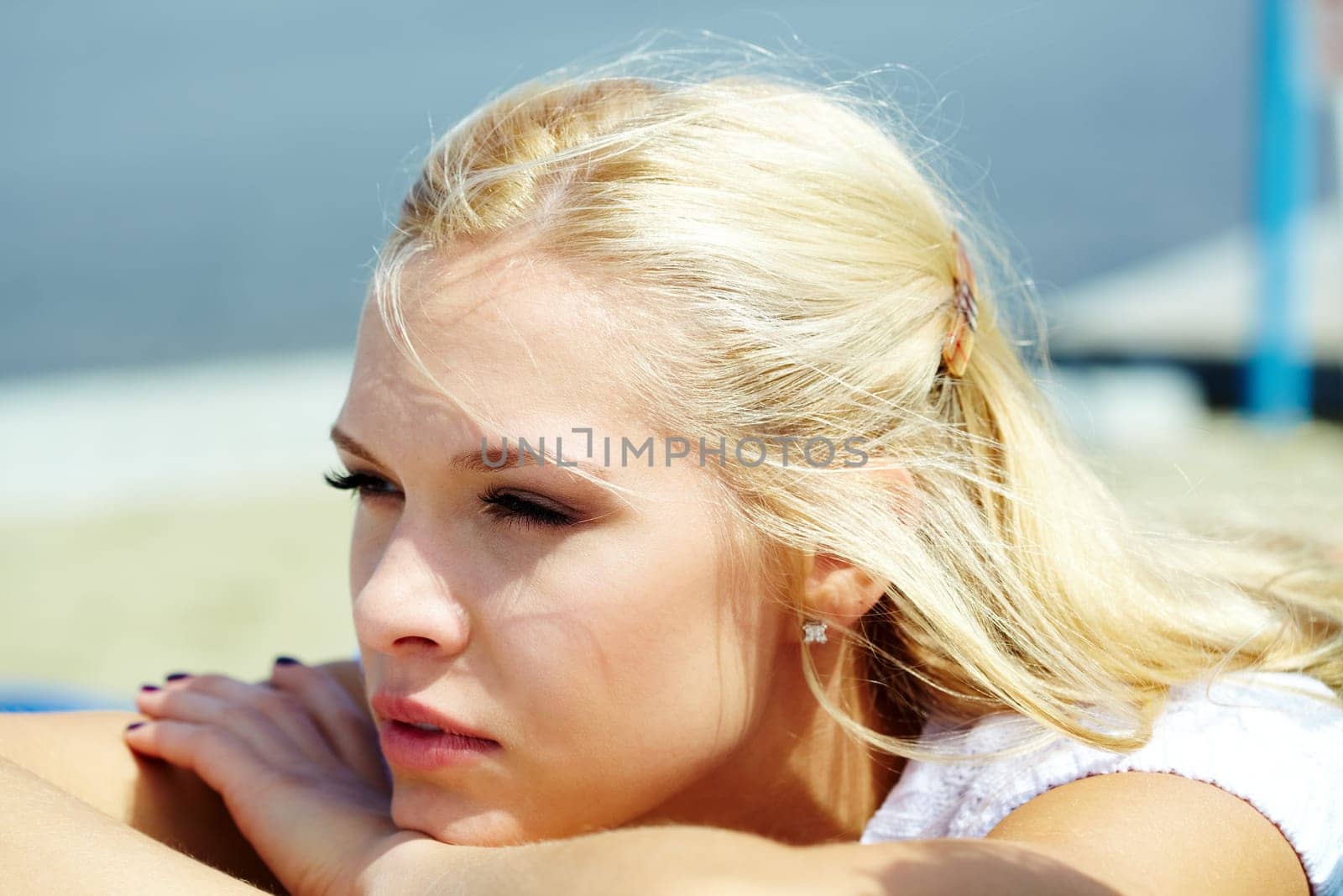 Photo of serene blond woman spending time outdoors