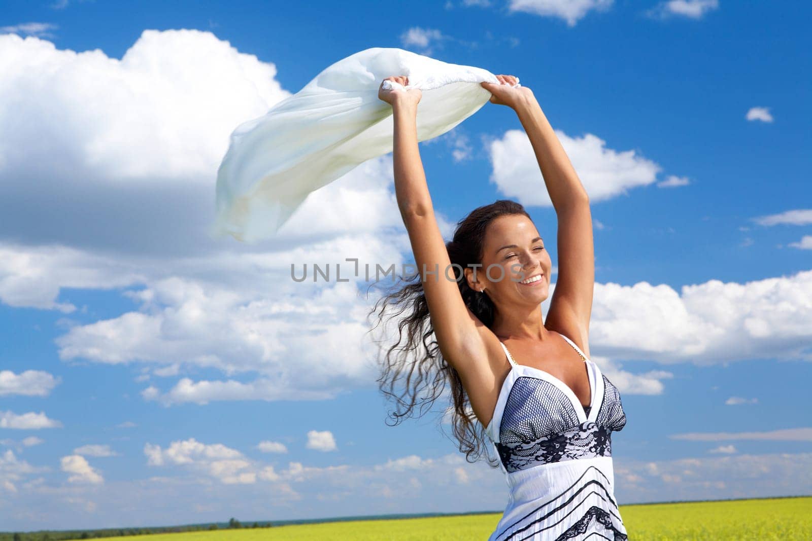 Image of happy woman holding a white fabric and laughing