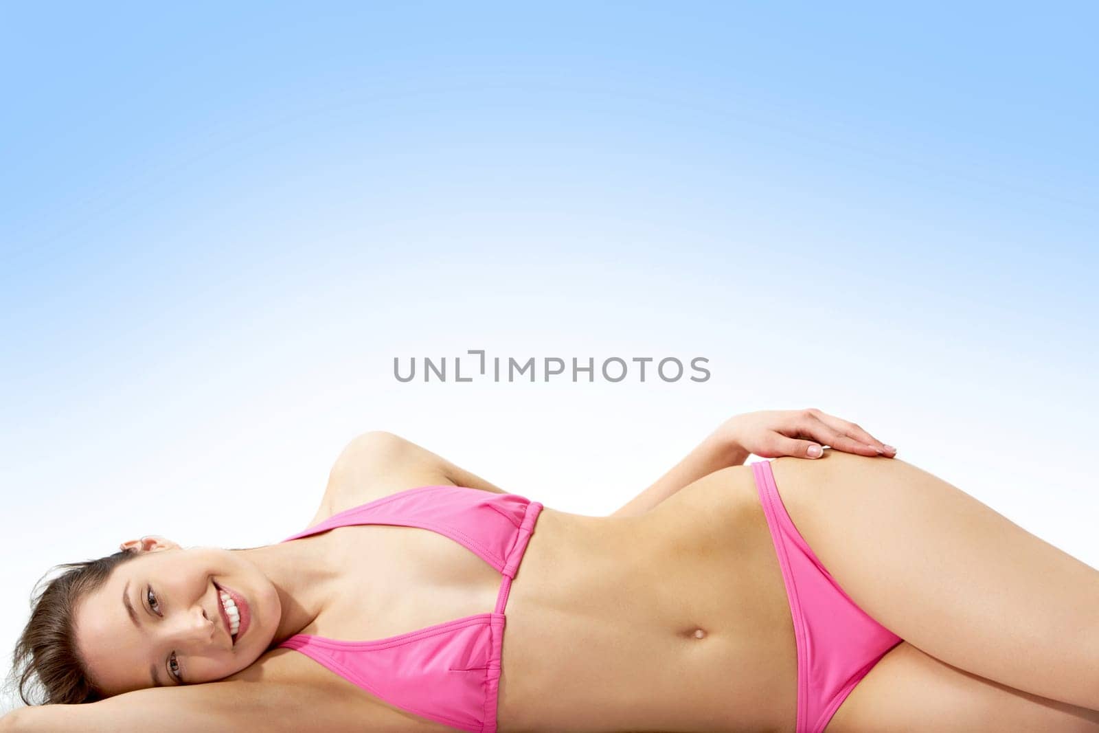 Image of pretty female in pink bikini posing in front of camera