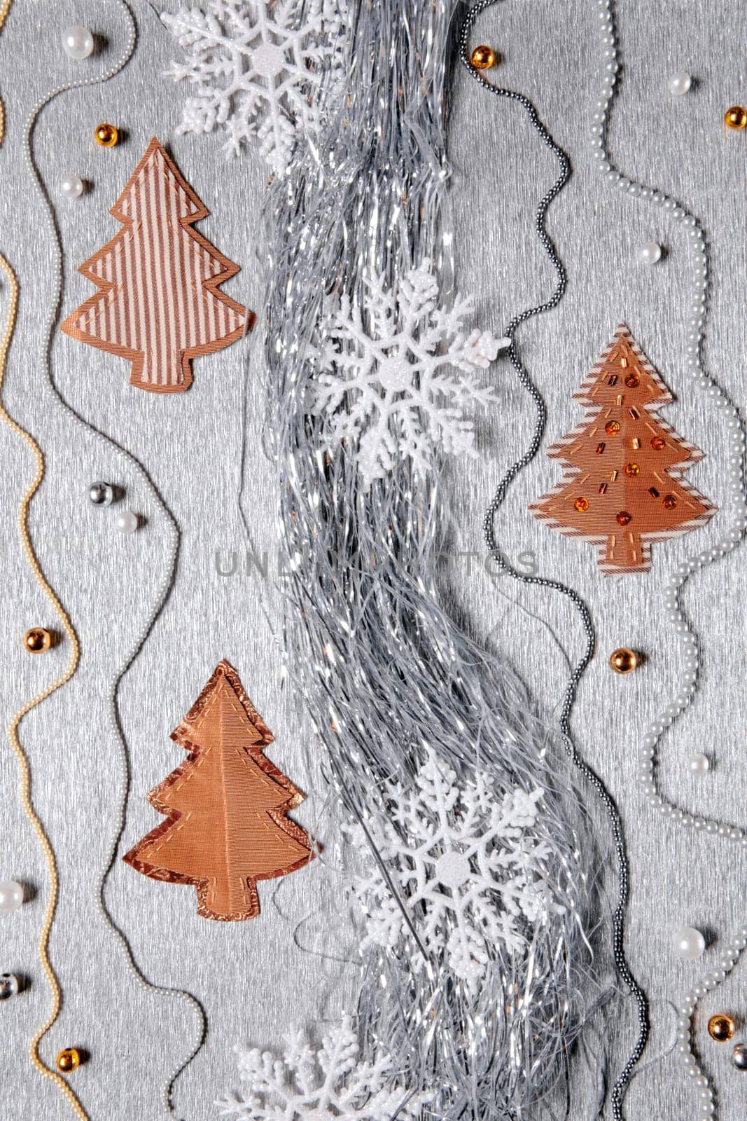 Different christmas decoration over silver background