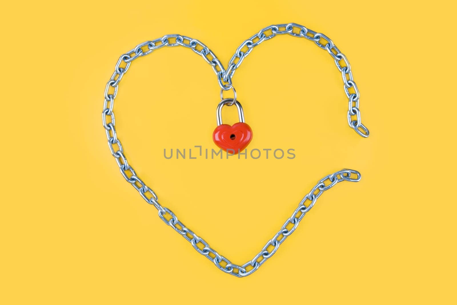 Image of heart made of iron with lock on the middle