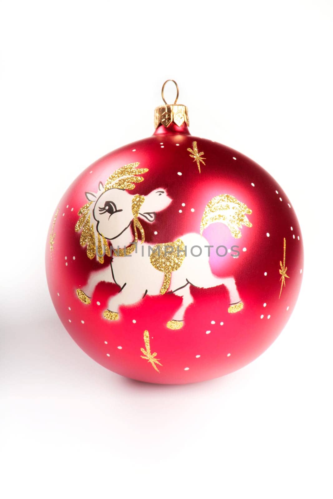 Red christmas ball with portrayal of pony