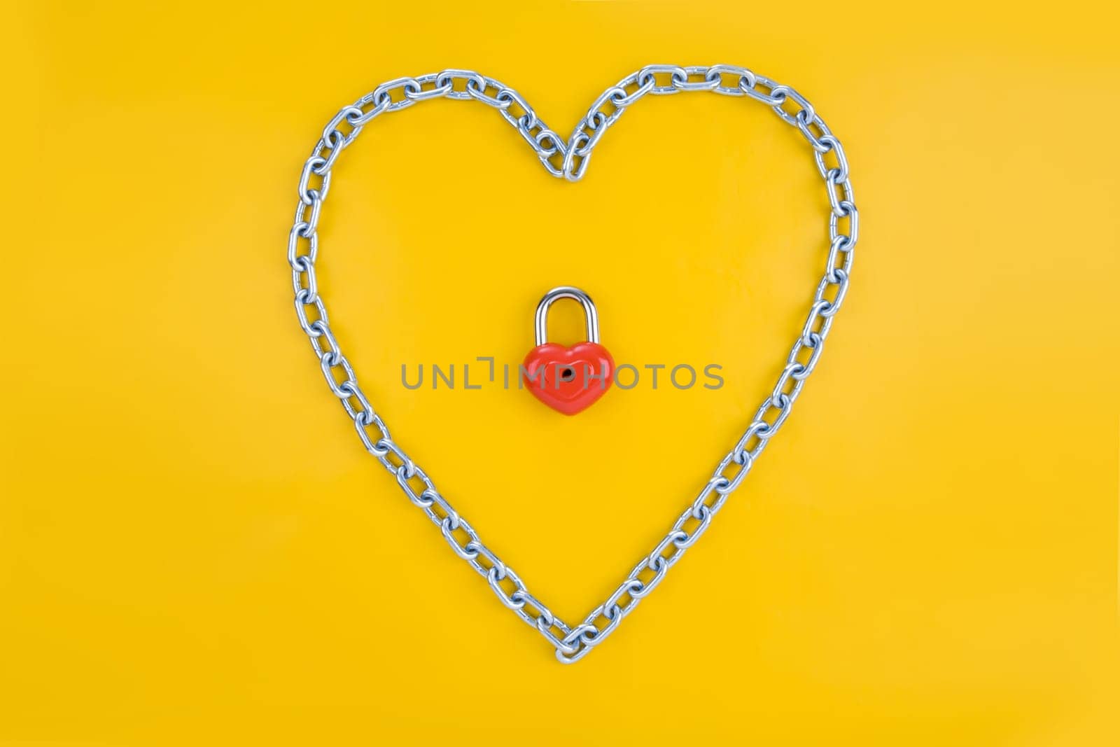 View of heart-shaped lock surrounded by chain