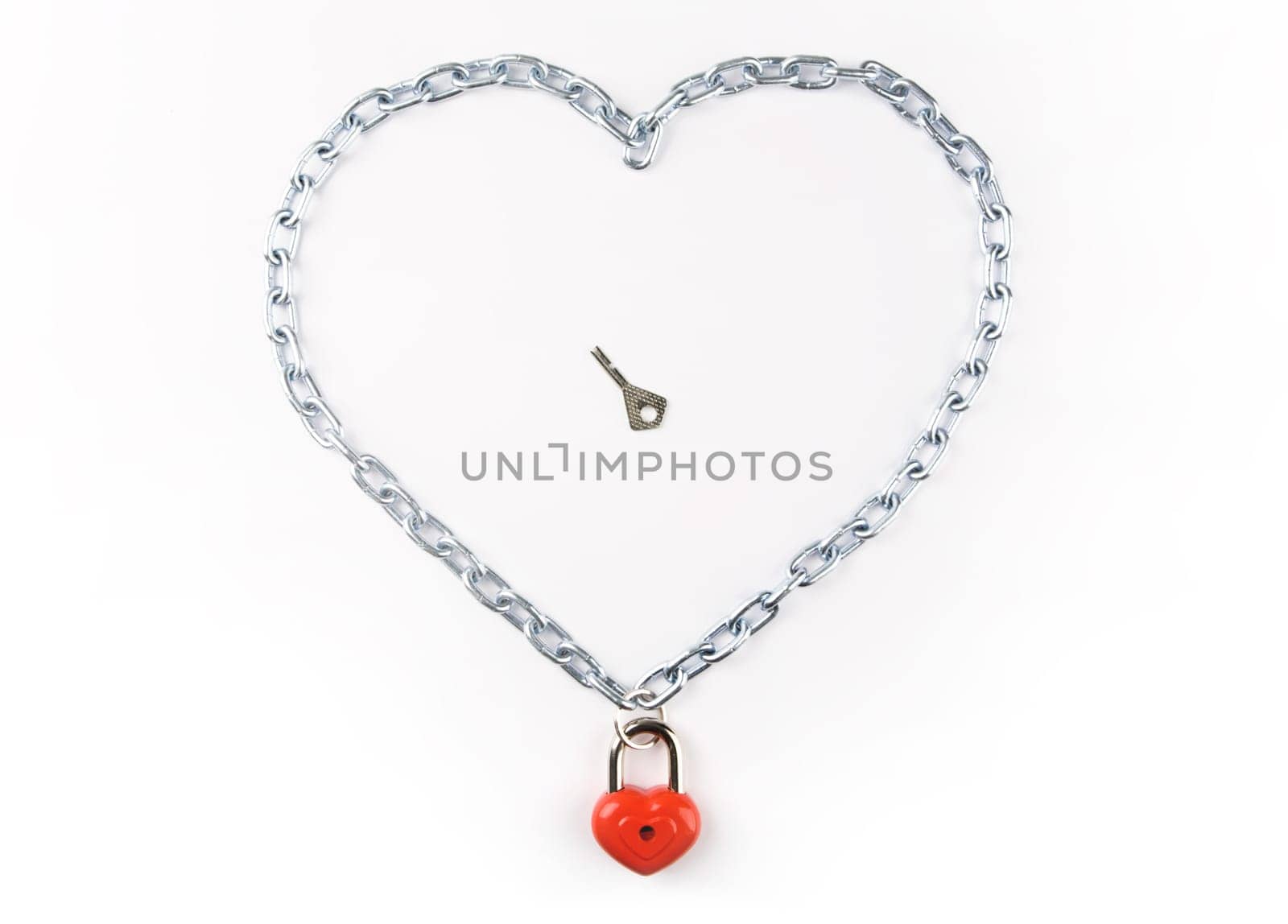 Photo of heart made of chain with lock and key