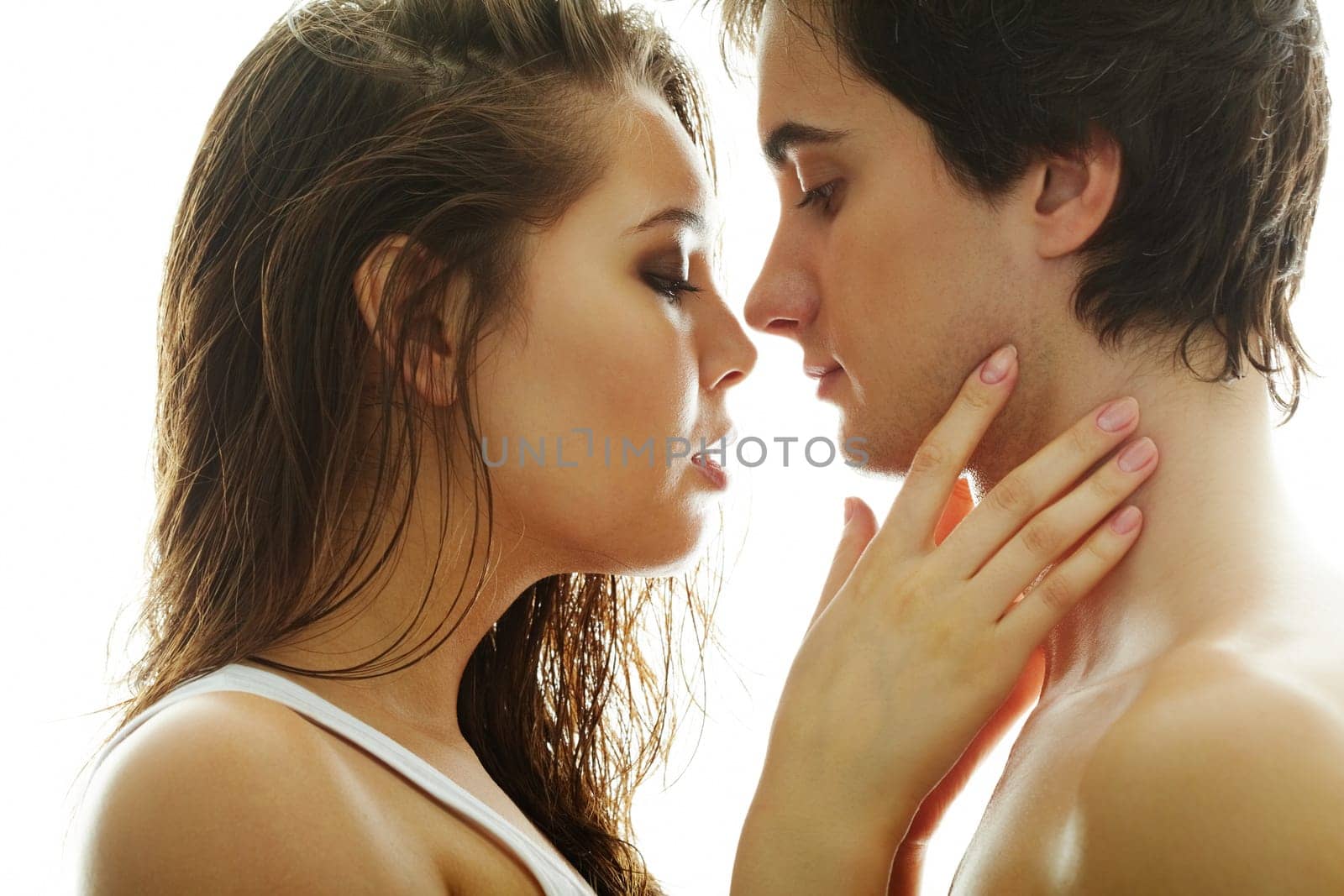 Pretty brunette and handsome man looking at one another