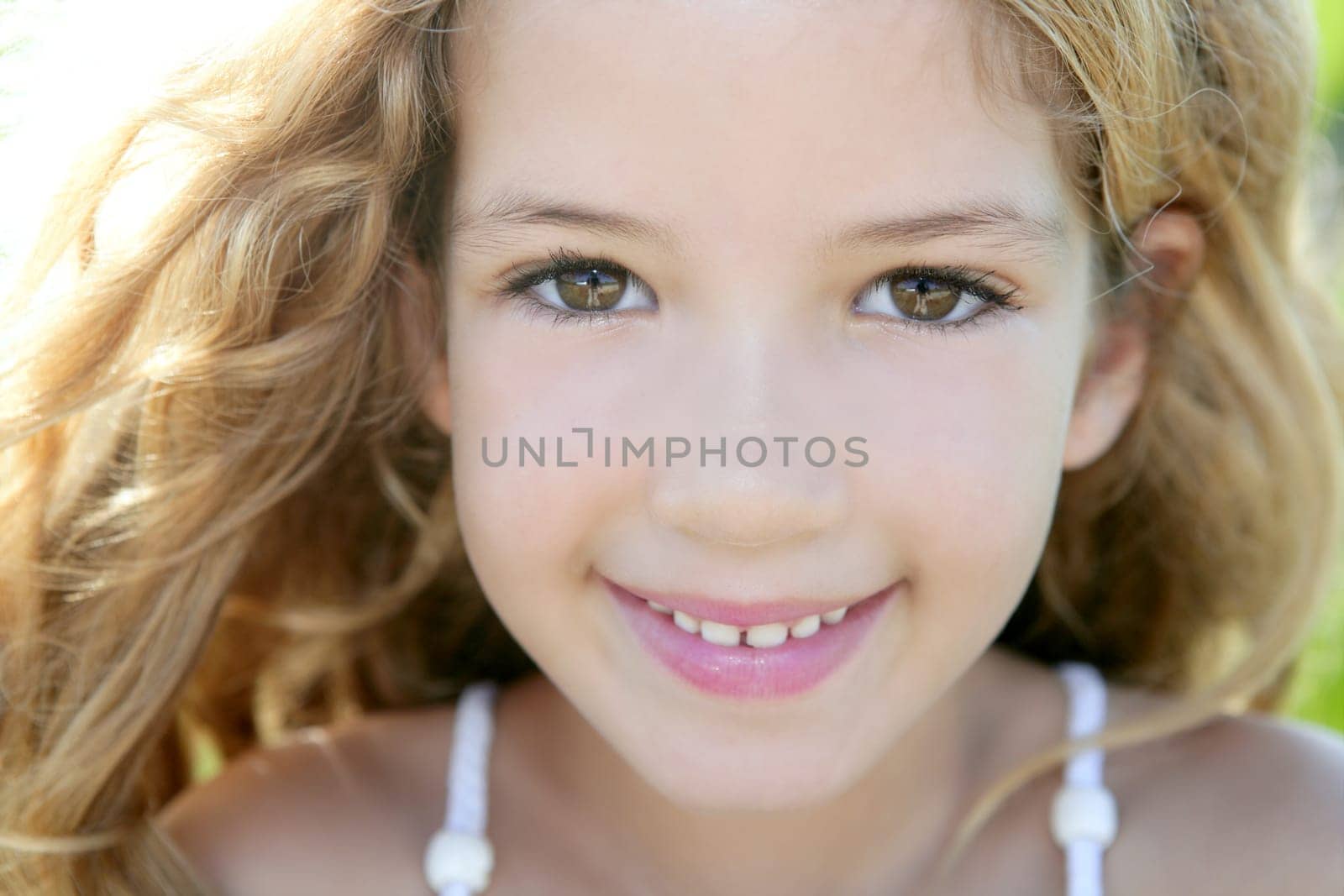 beautiful little girl portrait smiling closeup face looking camera
