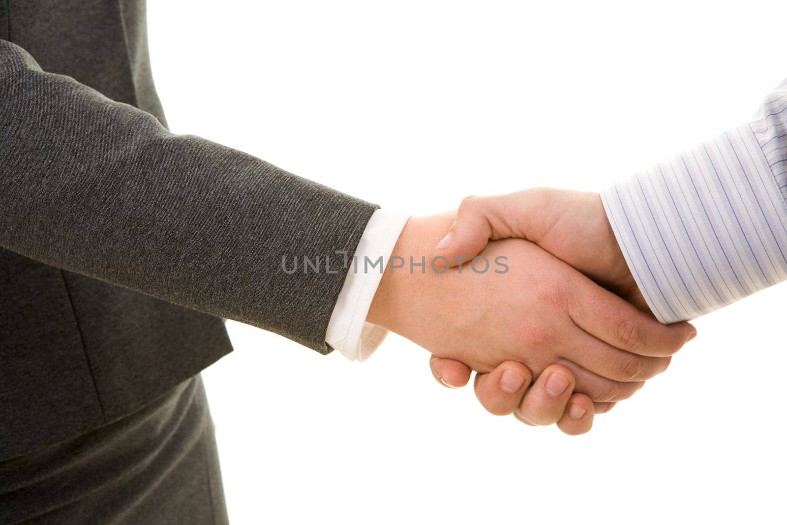 Photo of handshake of business partners after signing contract