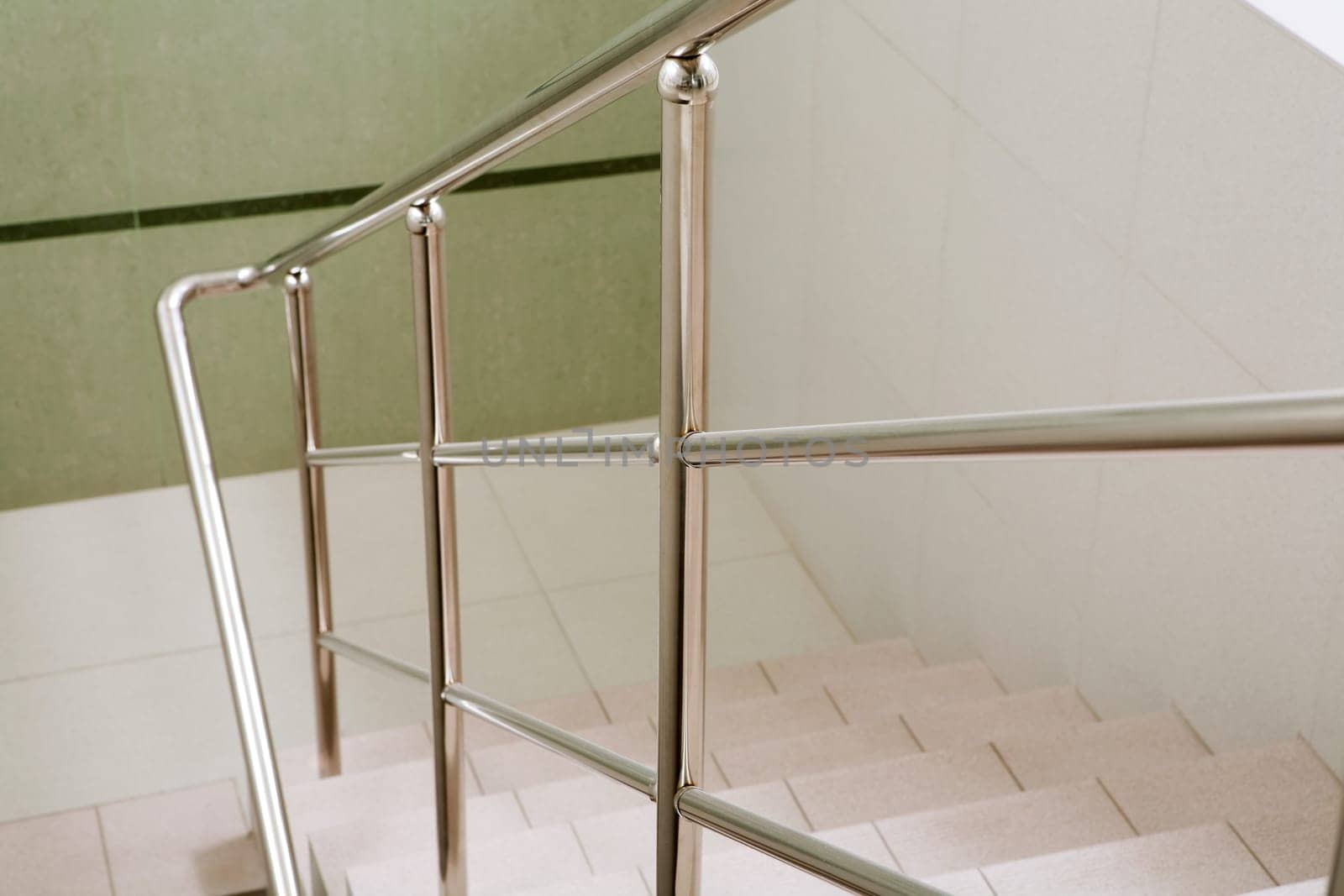Image of marble ladder in office building between floors