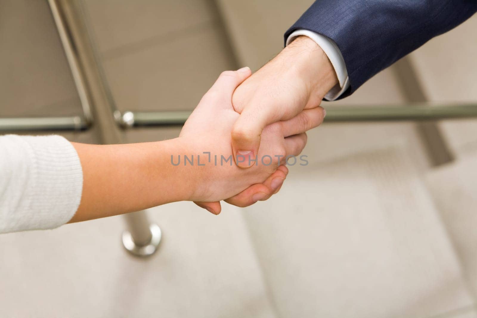 Image of partners handshake after signing contract