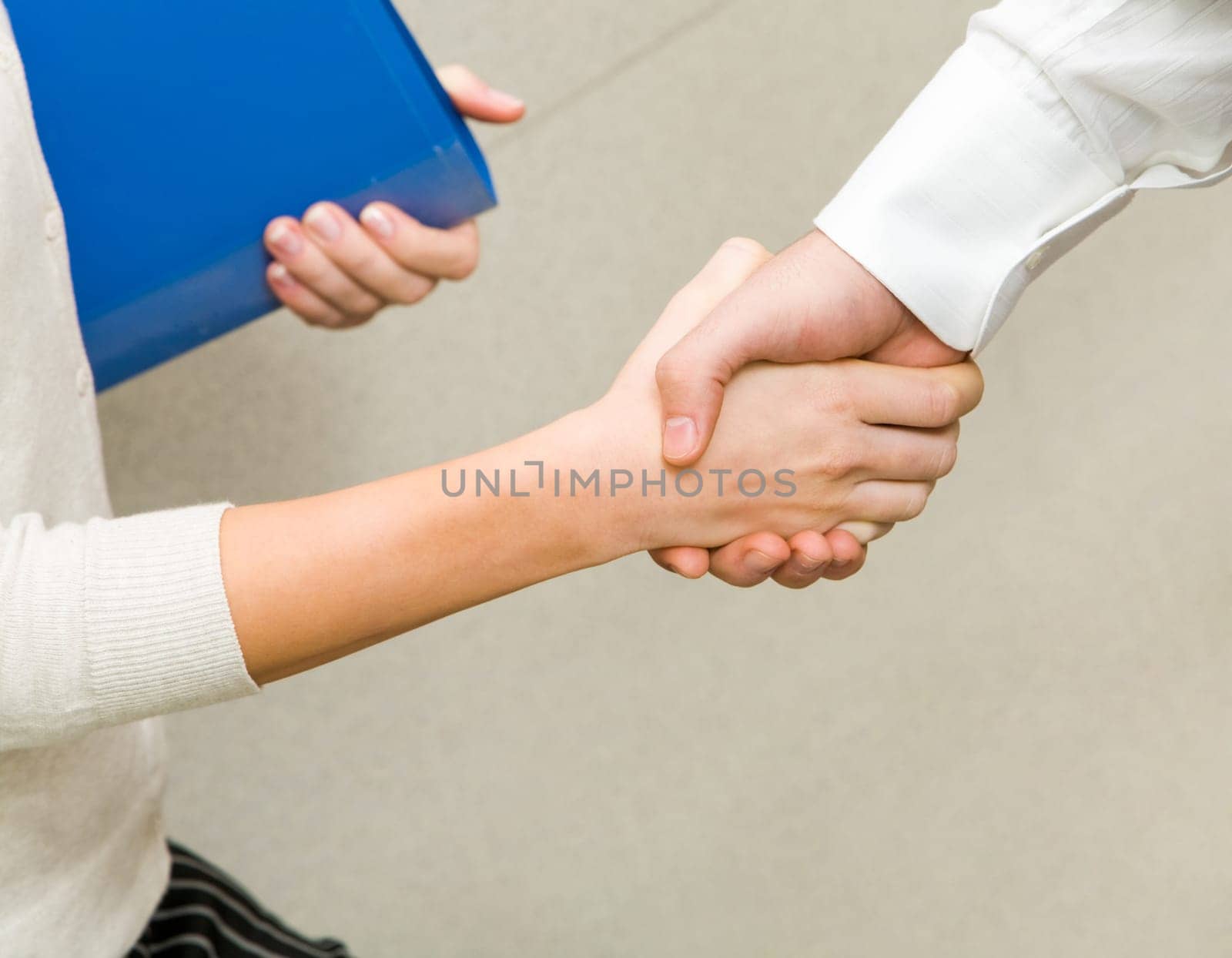 Image of partners handshake after signing contract