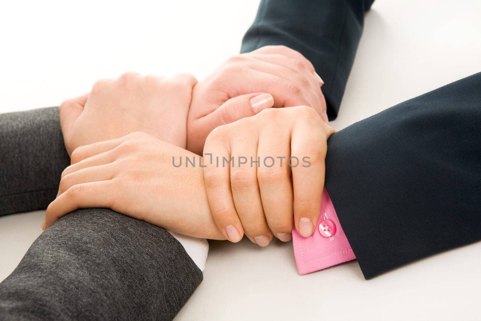 Image of crossed hands of business partners