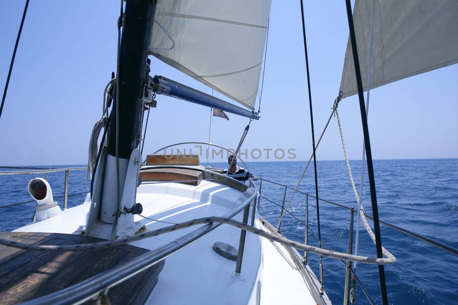Sailing with an old sailboat over blue mediterranean summer sea