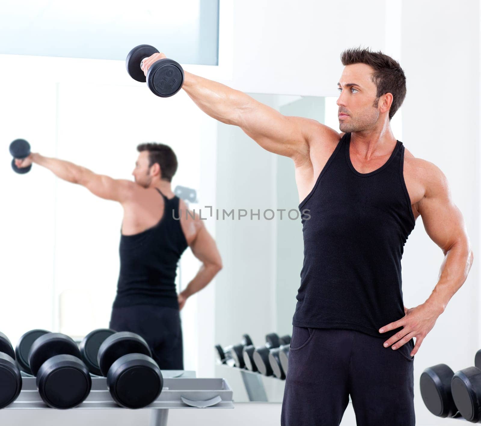 man with weight training equipment on sport gym club