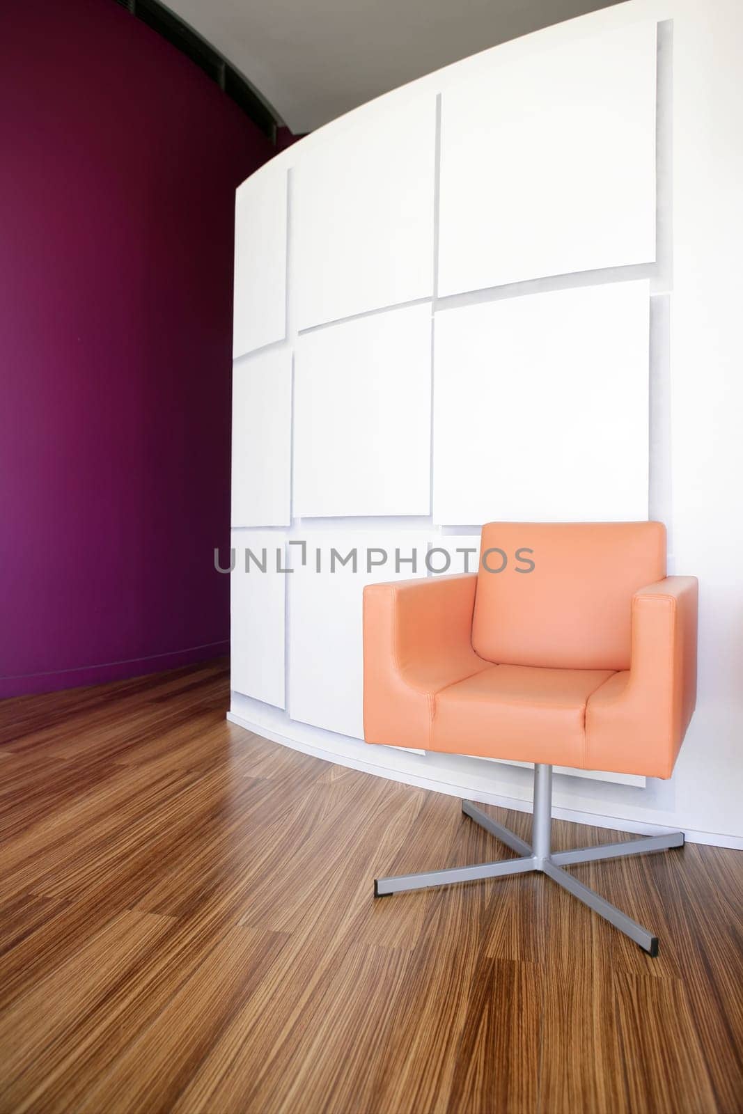 Modern office lobby interior design, orange leather chair , wooden floor