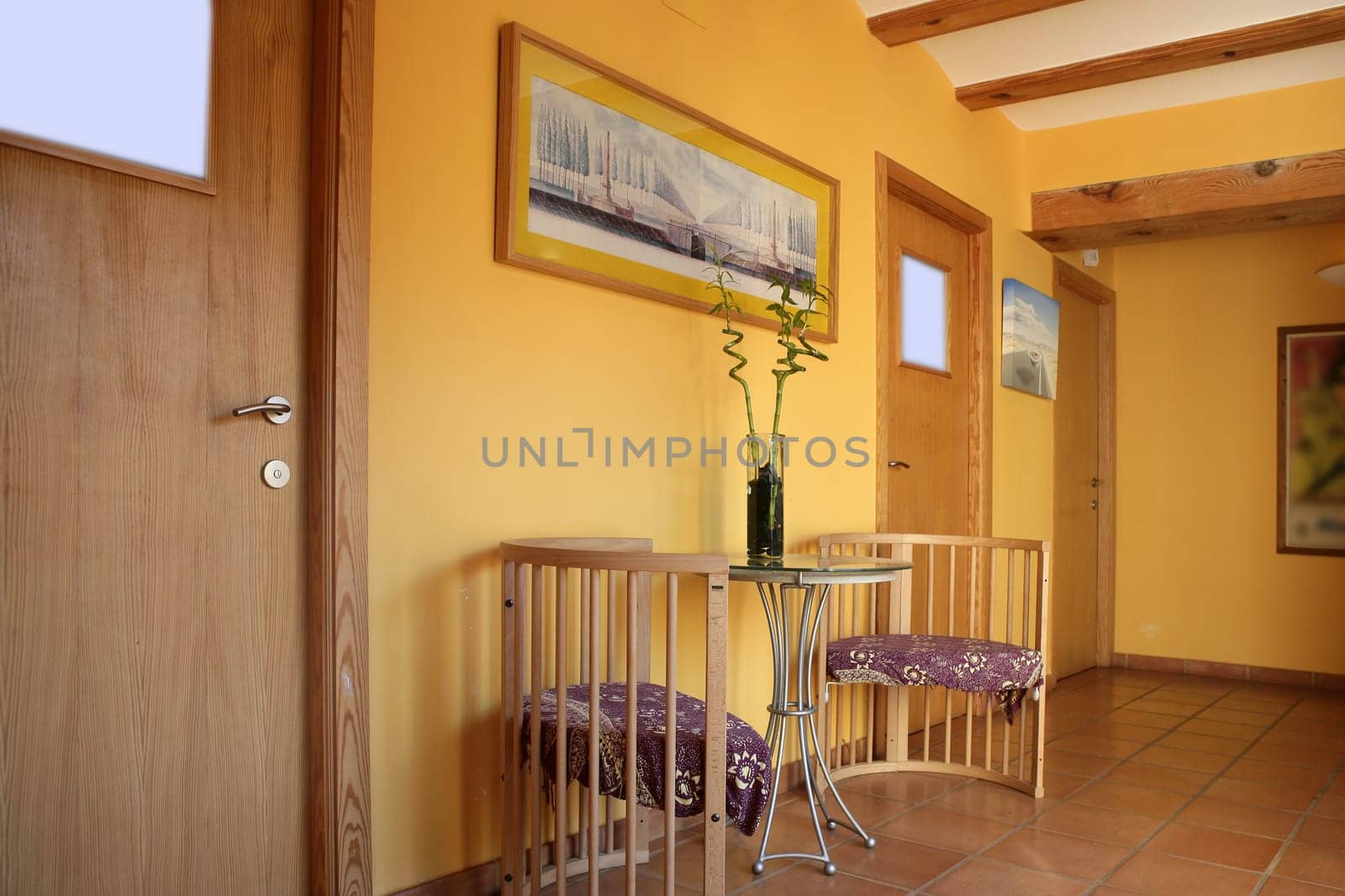 Lobbit, corridor in yellow color with wooden beams interior