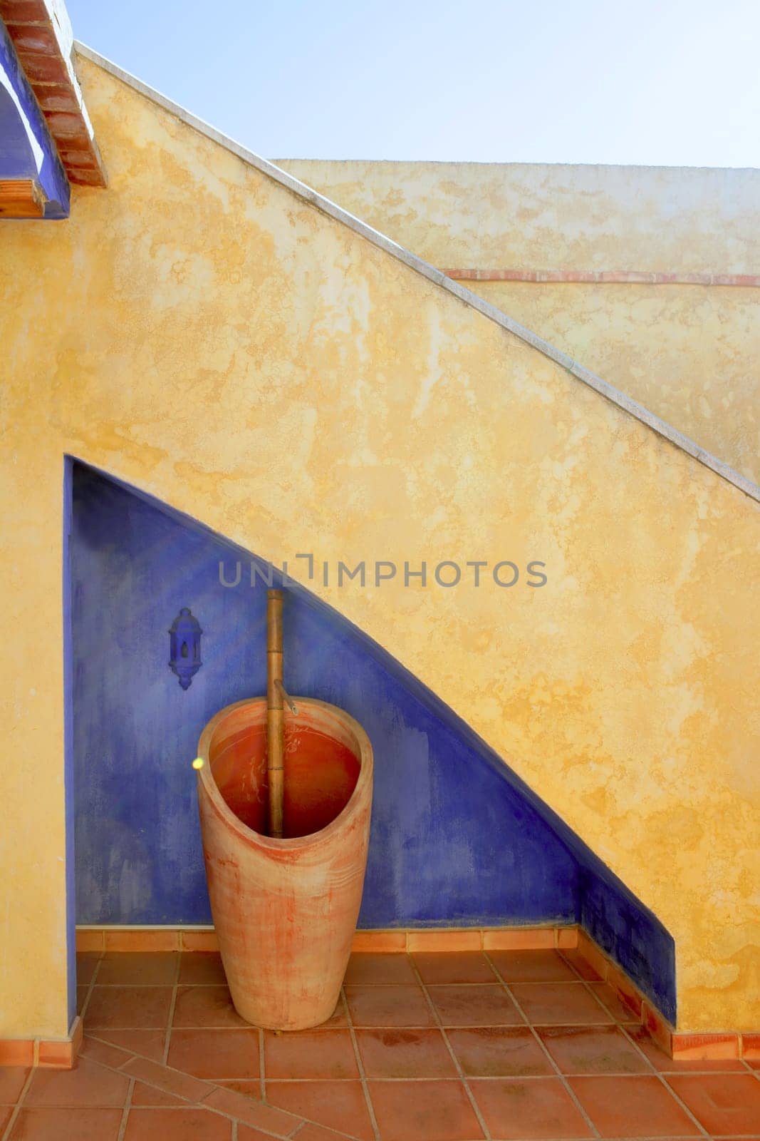 Spanish golden wall under stairs grunge blue, nice courtyard