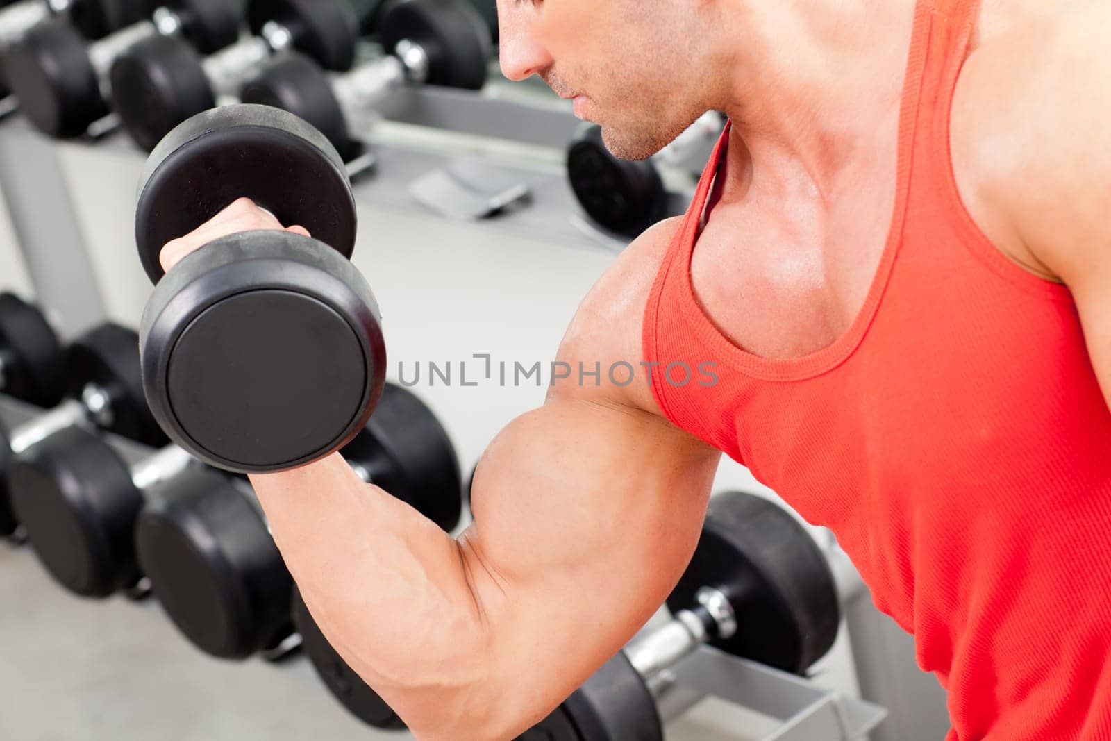 man with weight training equipment on sport gym club