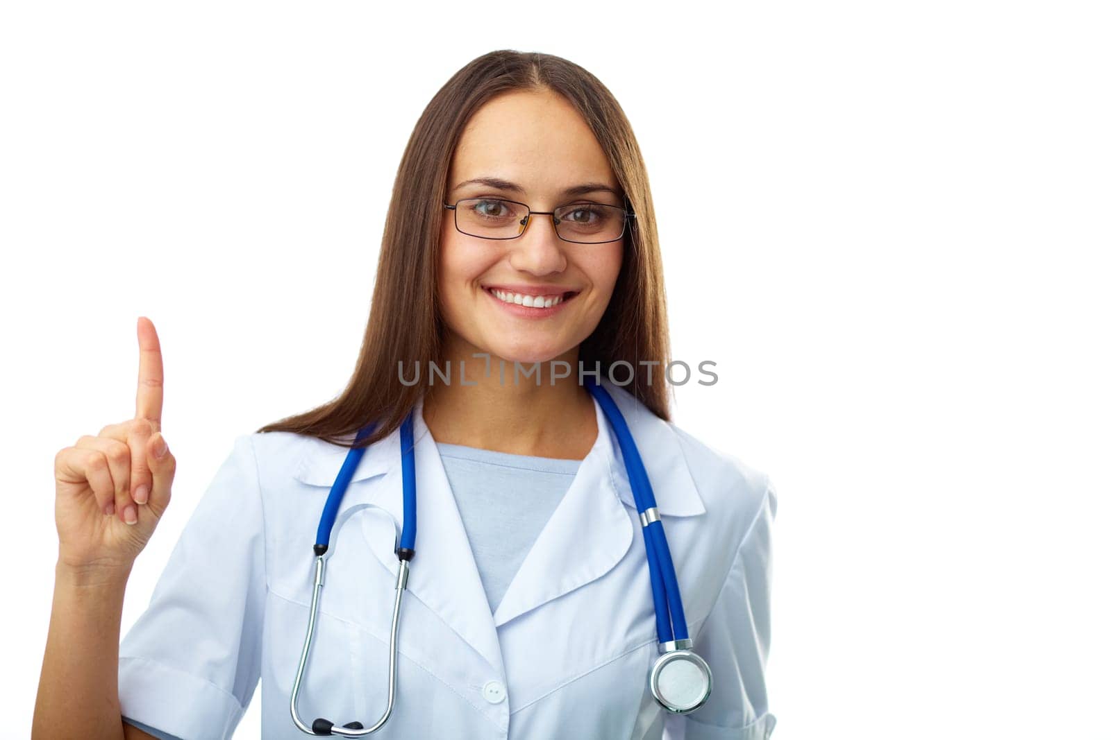 Portrait of happy female doctor pointing upwards