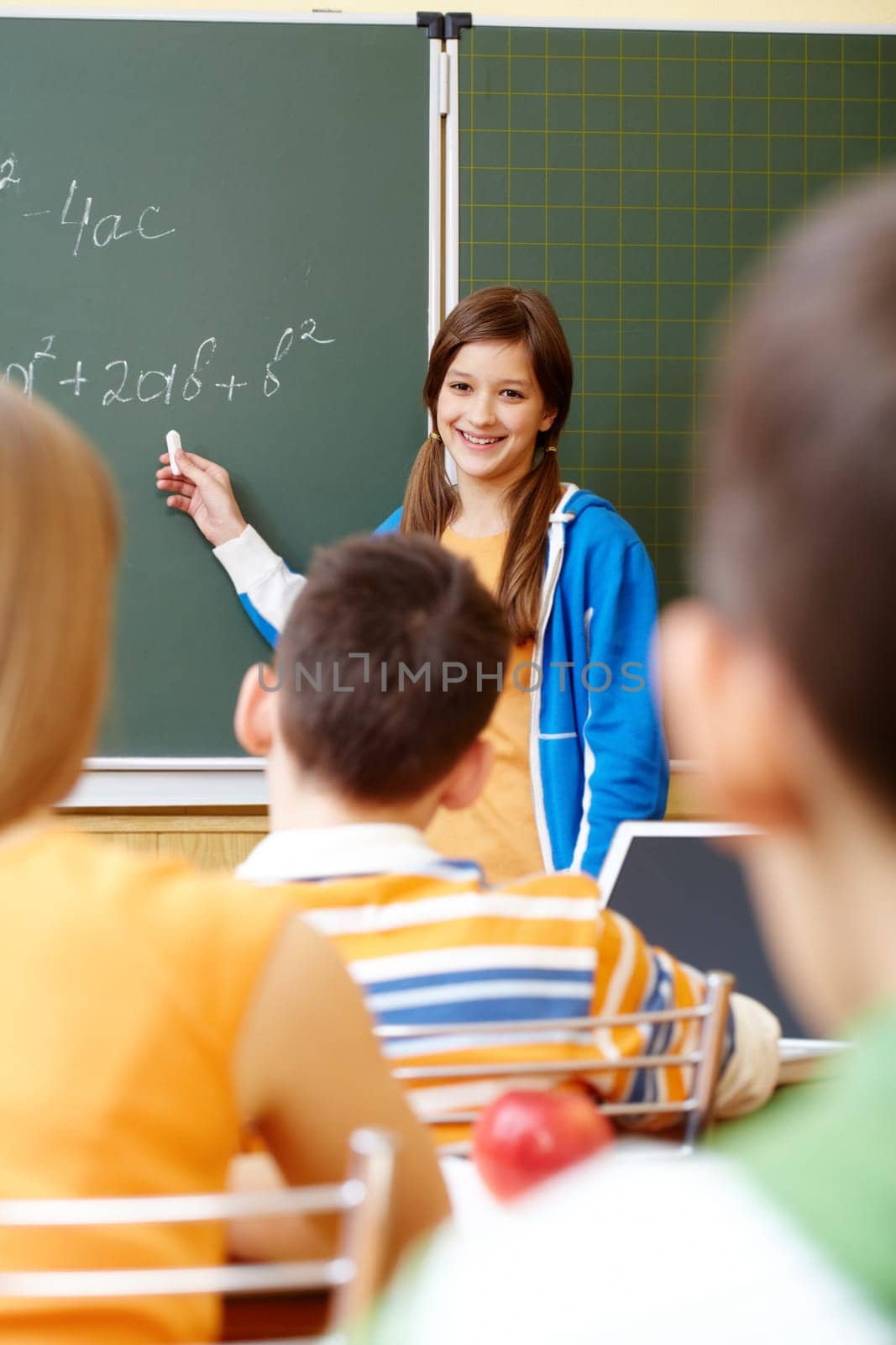 Confident student looking at camera in classroom
