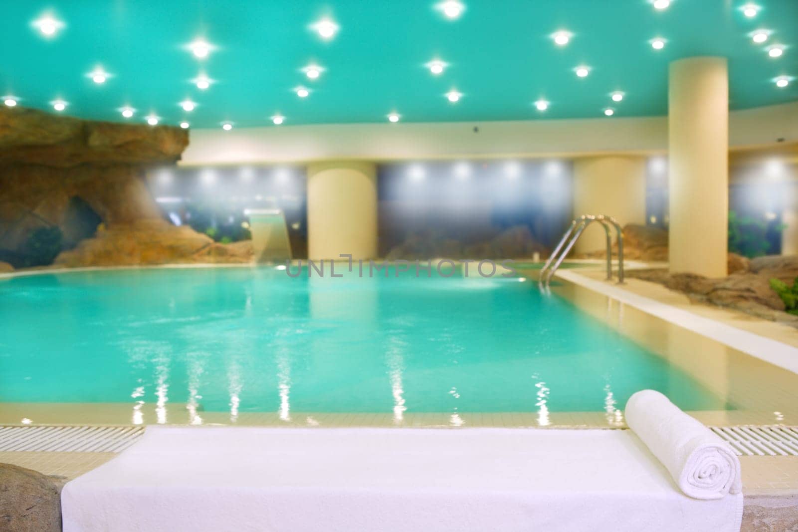 spa indoor turquoise saloon water white towel lights ceiling