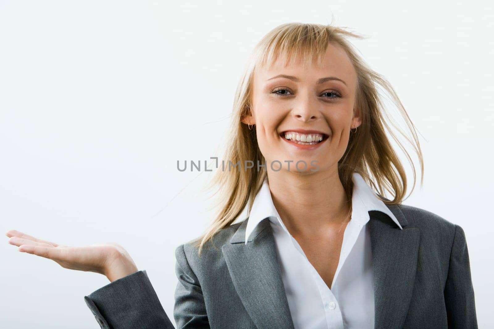 Young  stylish business woman holding elegantly her hand on the white background