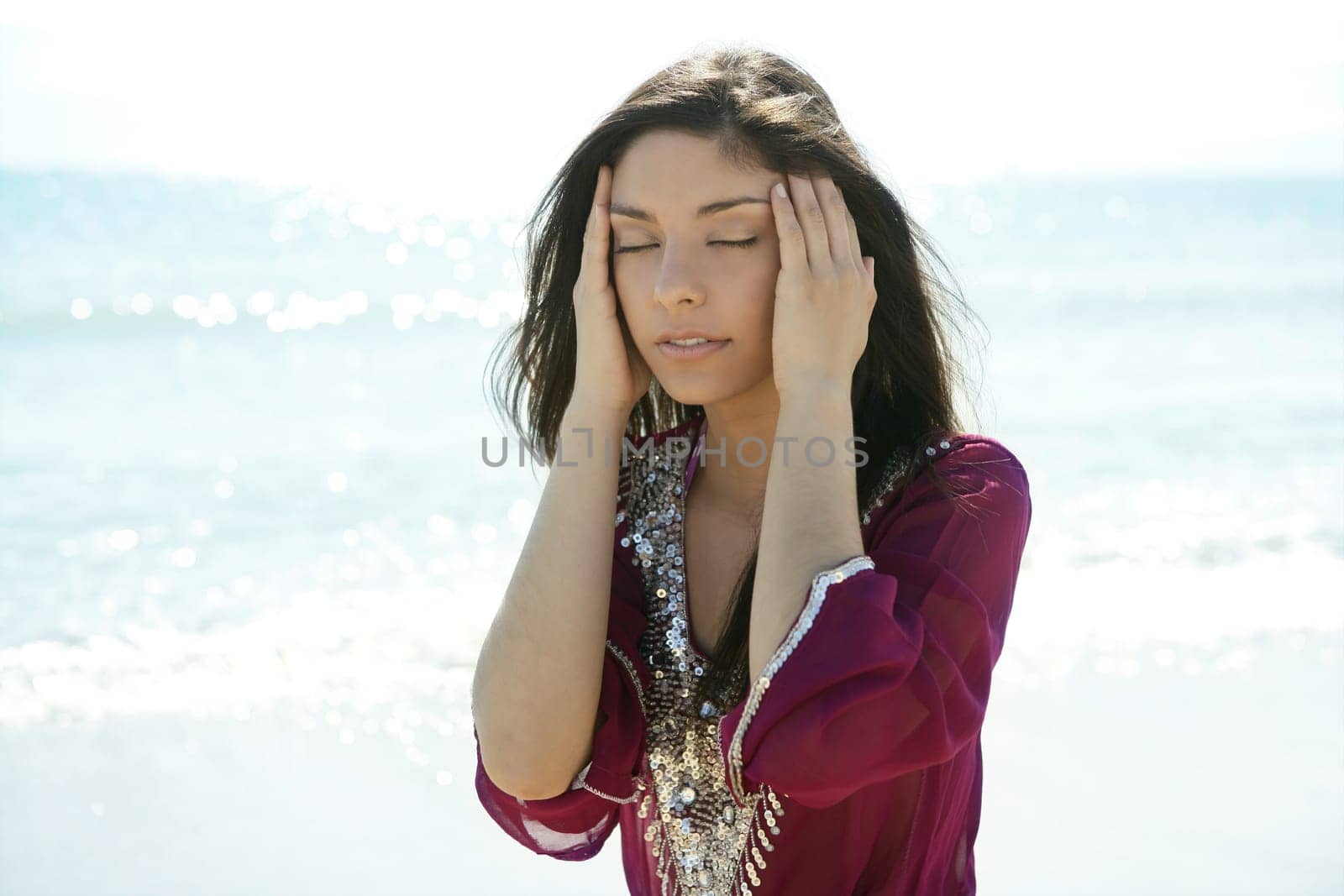 beautiful indian woman relaxing on the beach