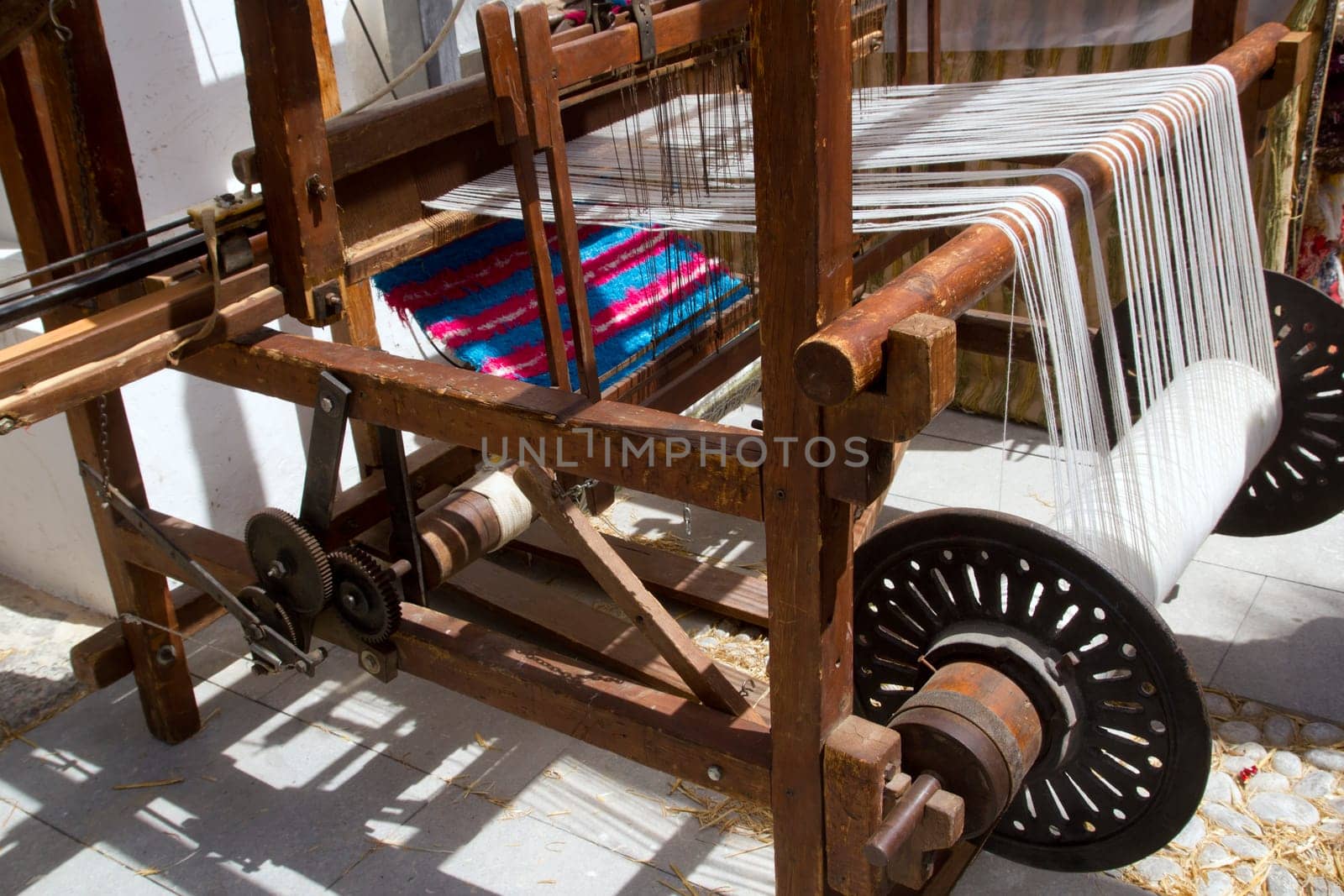 antique vintage spinner machine working in mediterranean fabric