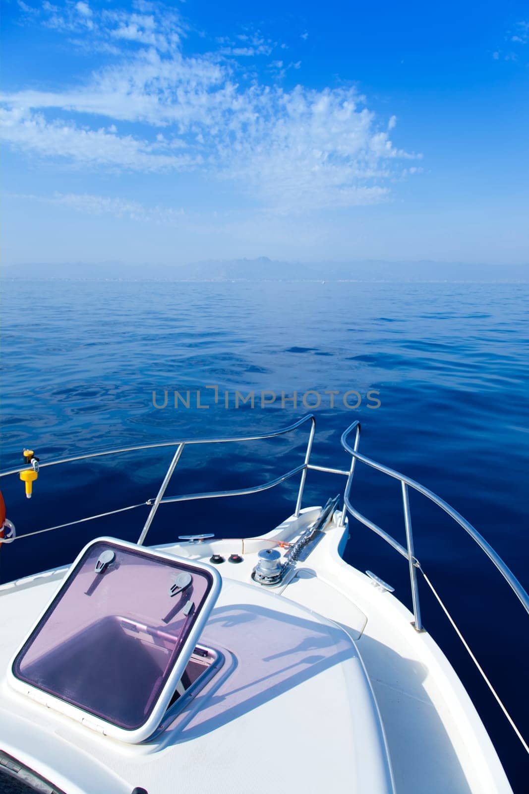 Blue sea boat sailing with open bow porthole in summer vacations