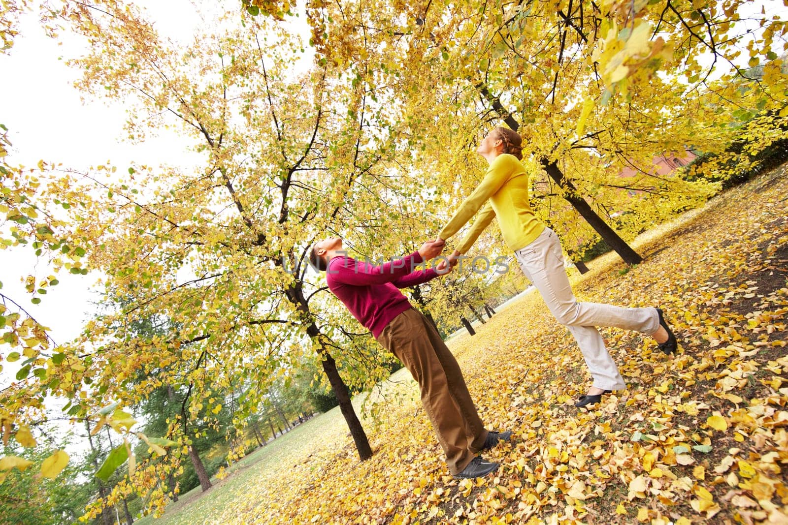 Happy couple enjoying autumn in park