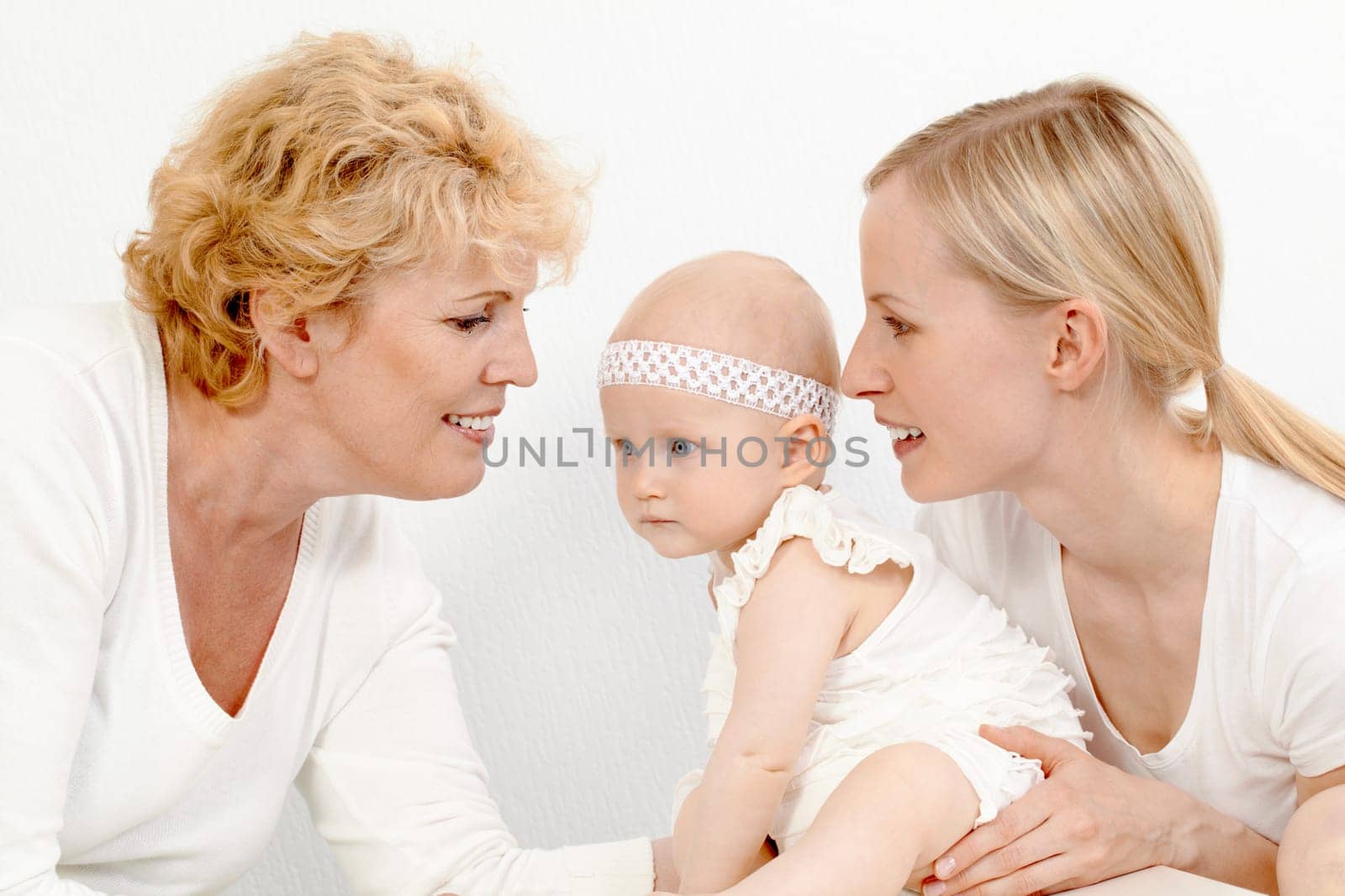 Portrait of happy grandmother, mother and cute baby girl