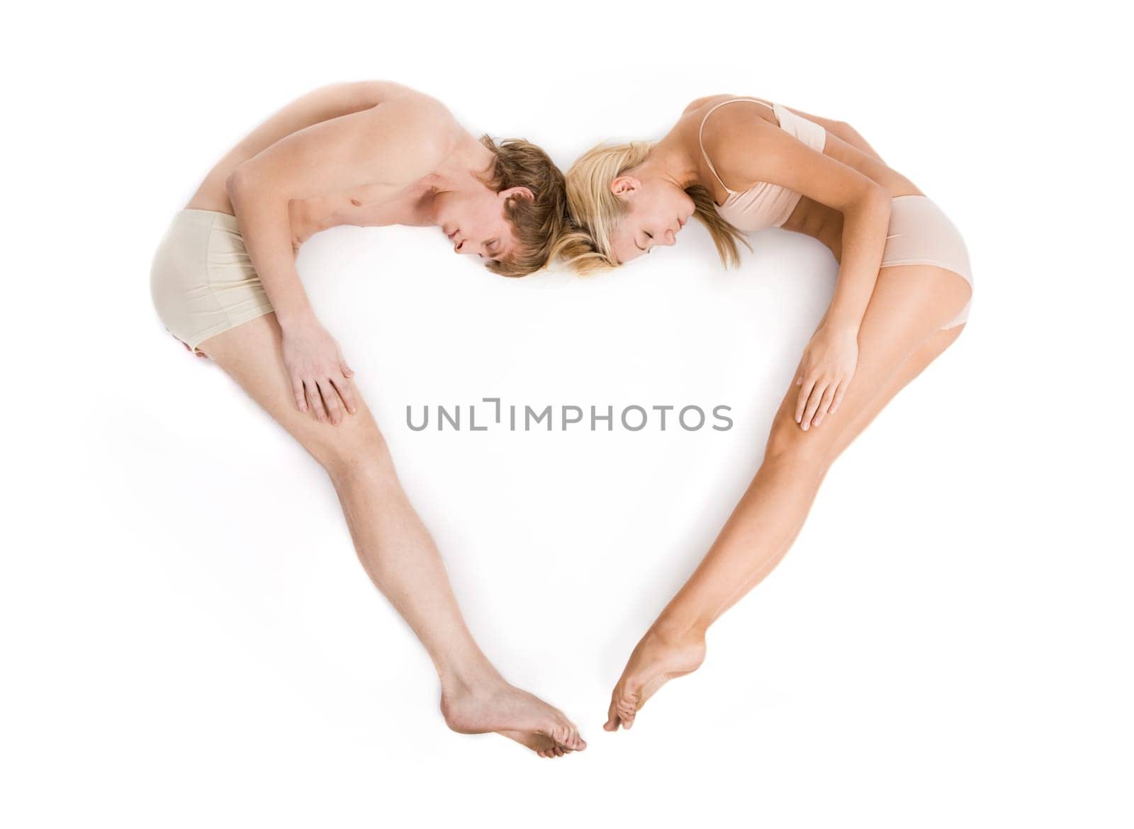 Creative image of couple lying and forming heart over white background