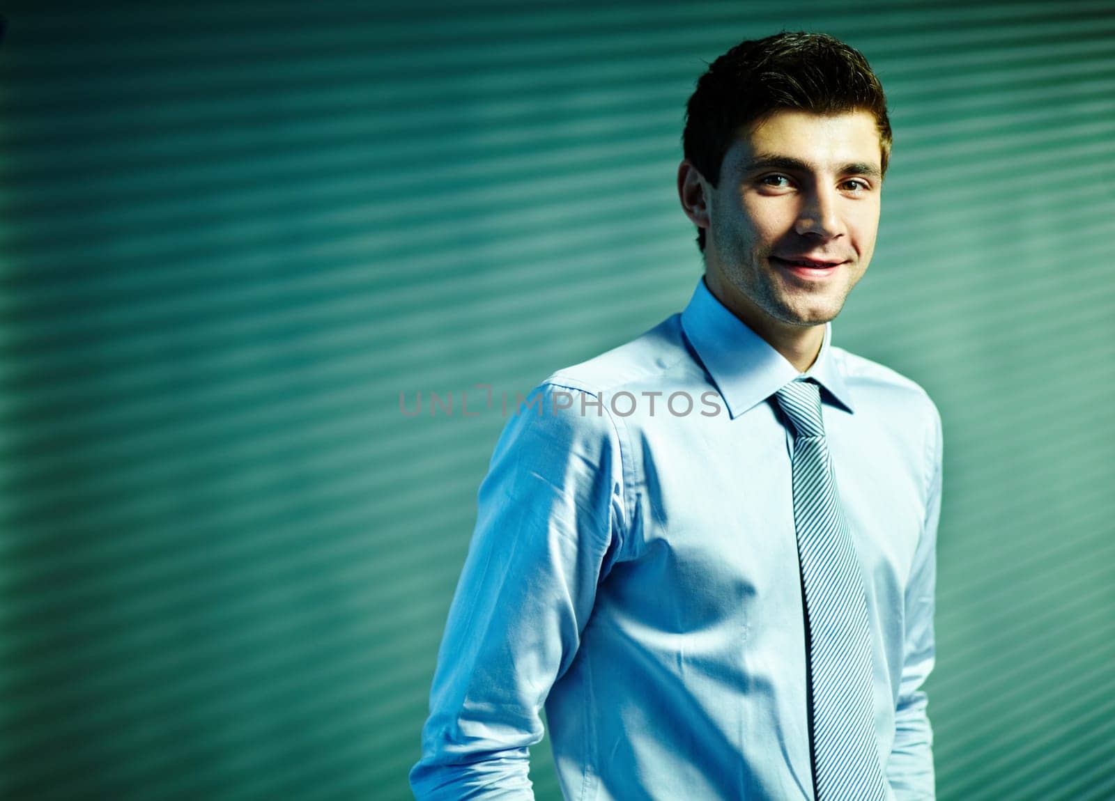 Portrait of attractive male looking at camera with smile