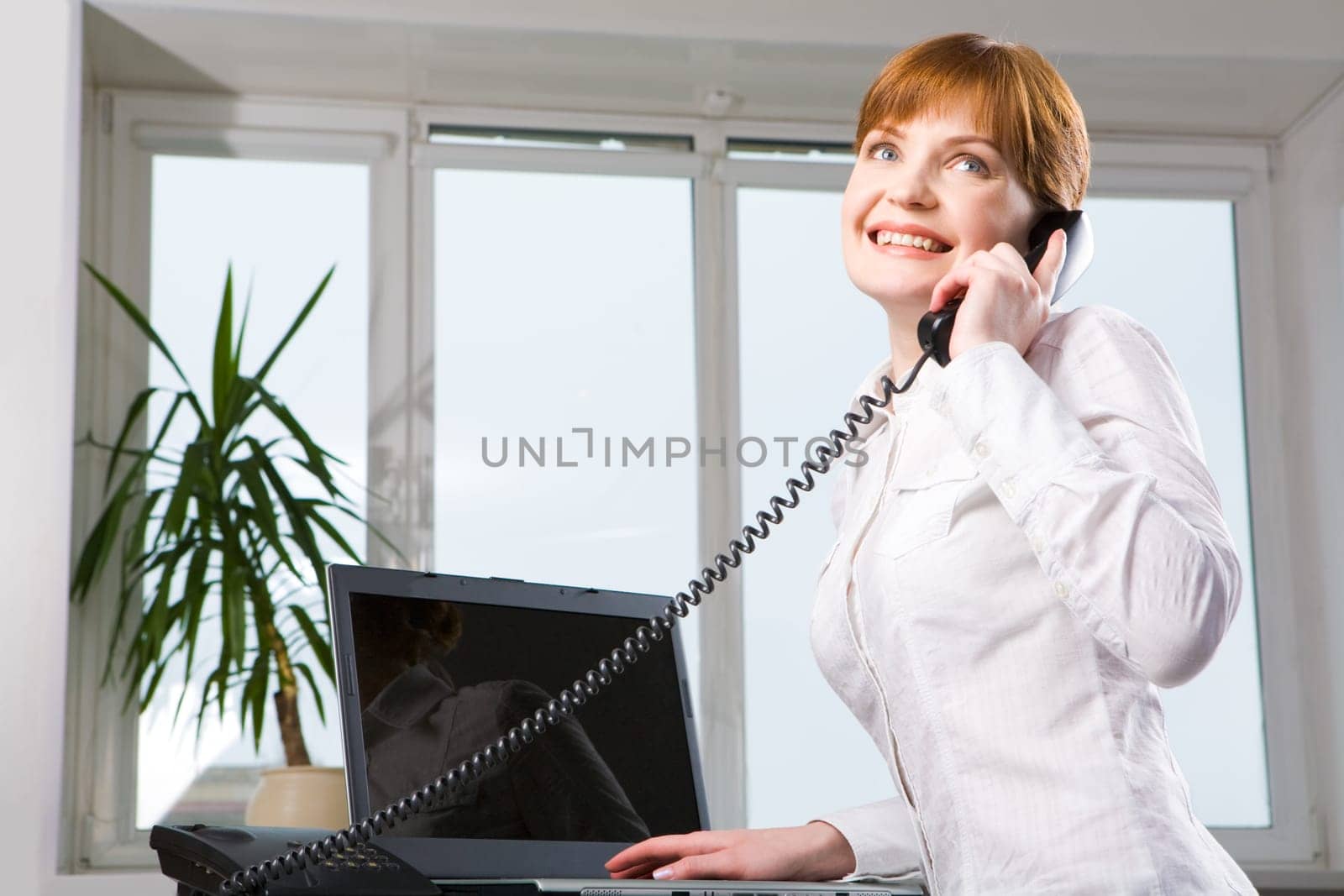 Image of executive manager calling by telephone in the office