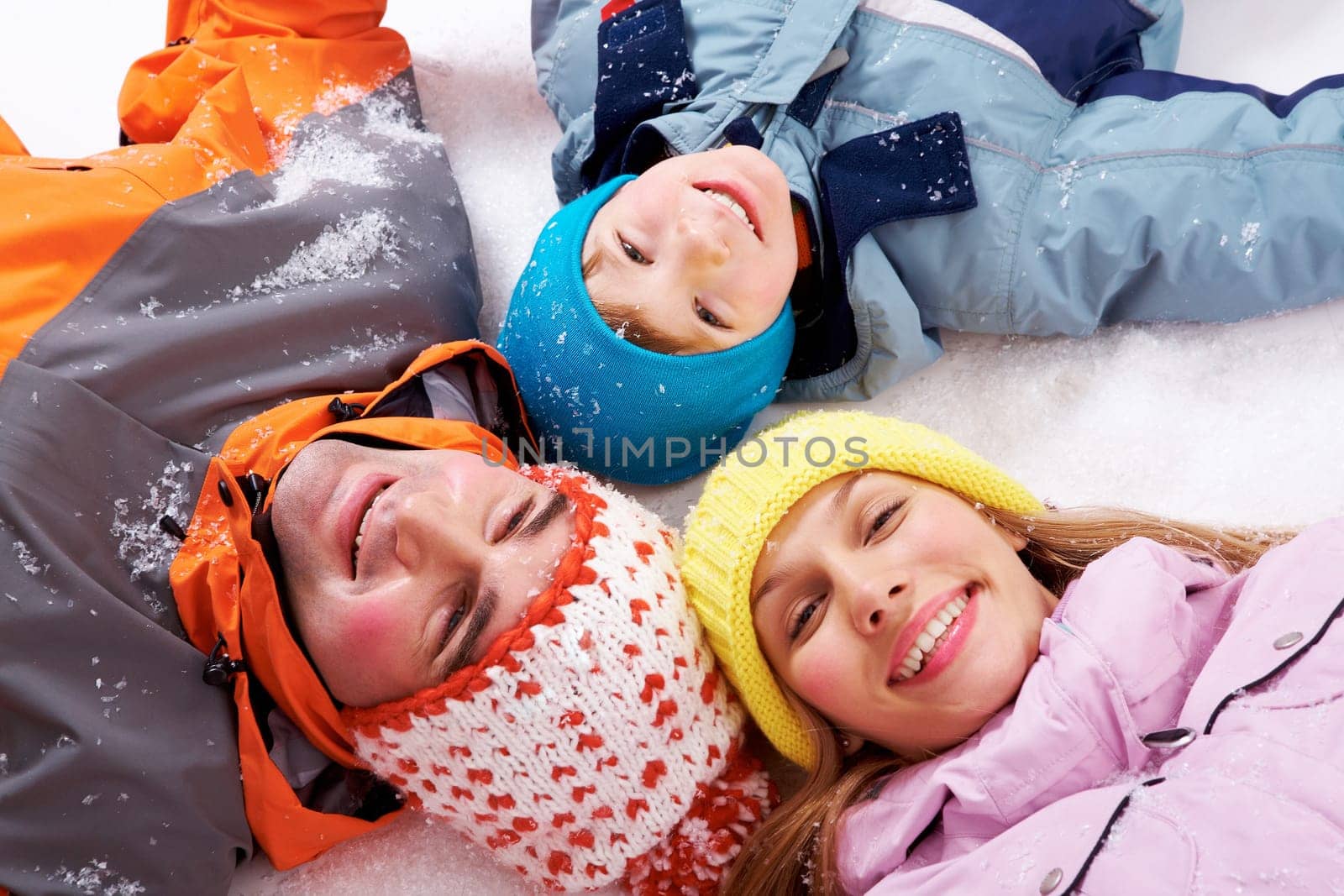 Above angle of happy family looking at camera
