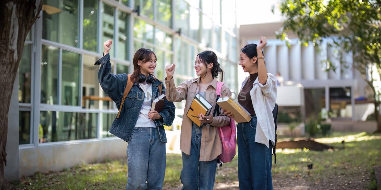 University student friendship concept with classmate friend walk together at campus college park. Youth teenage and education.