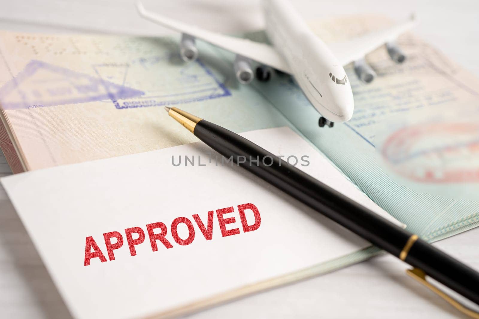 Approved Stamp visa and passport document to immigration at airport in country.
