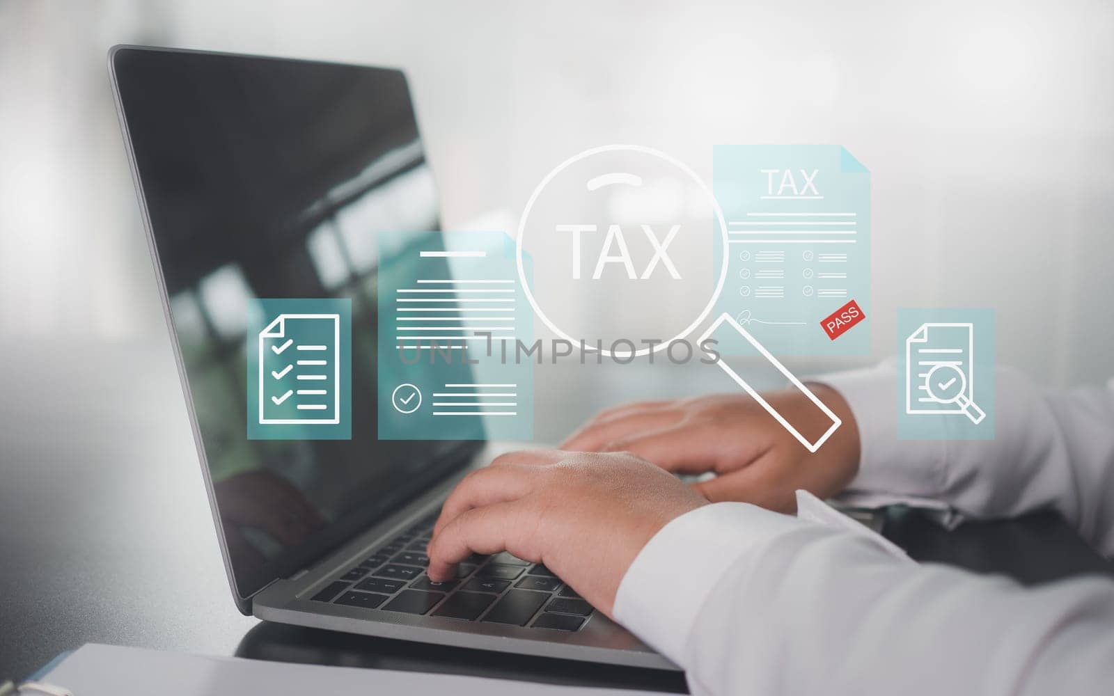 Businesswoman uses computer to fill out online tax return form to pay taxes It represents financial research and tax return calculations. by Unimages2527